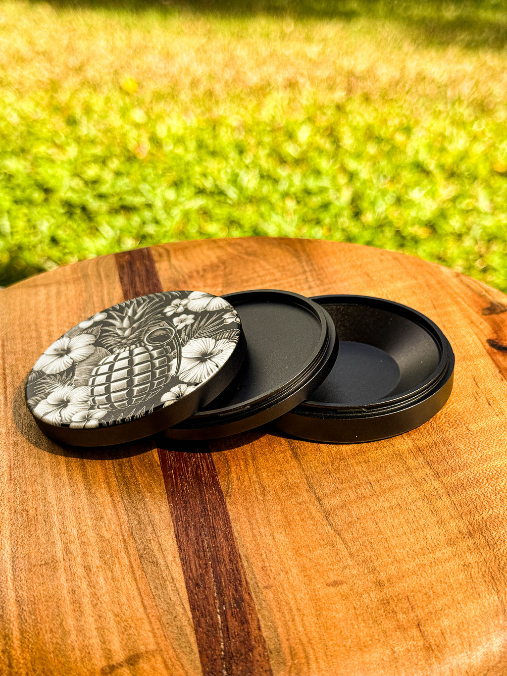 Metal Zyn Can for nicotine pouches with floral and pineapple grenade engraved design. With integrated bottle opener. 