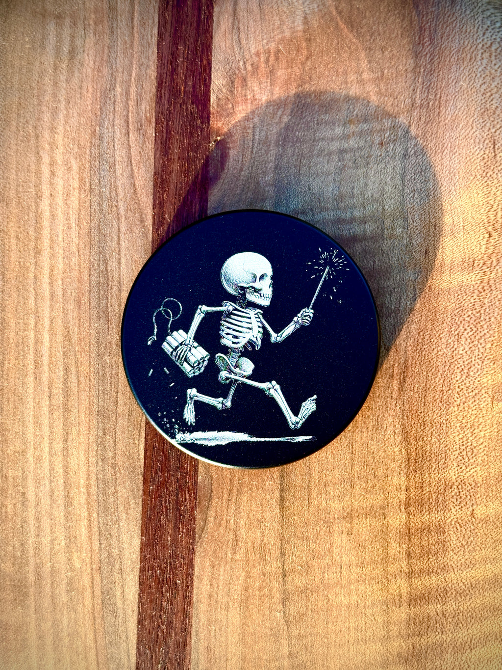 Metal Zyn Can for nicotine pouches with Skeleton carrying a sparkler and dynamite engraved design. With integrated bottle opener. 