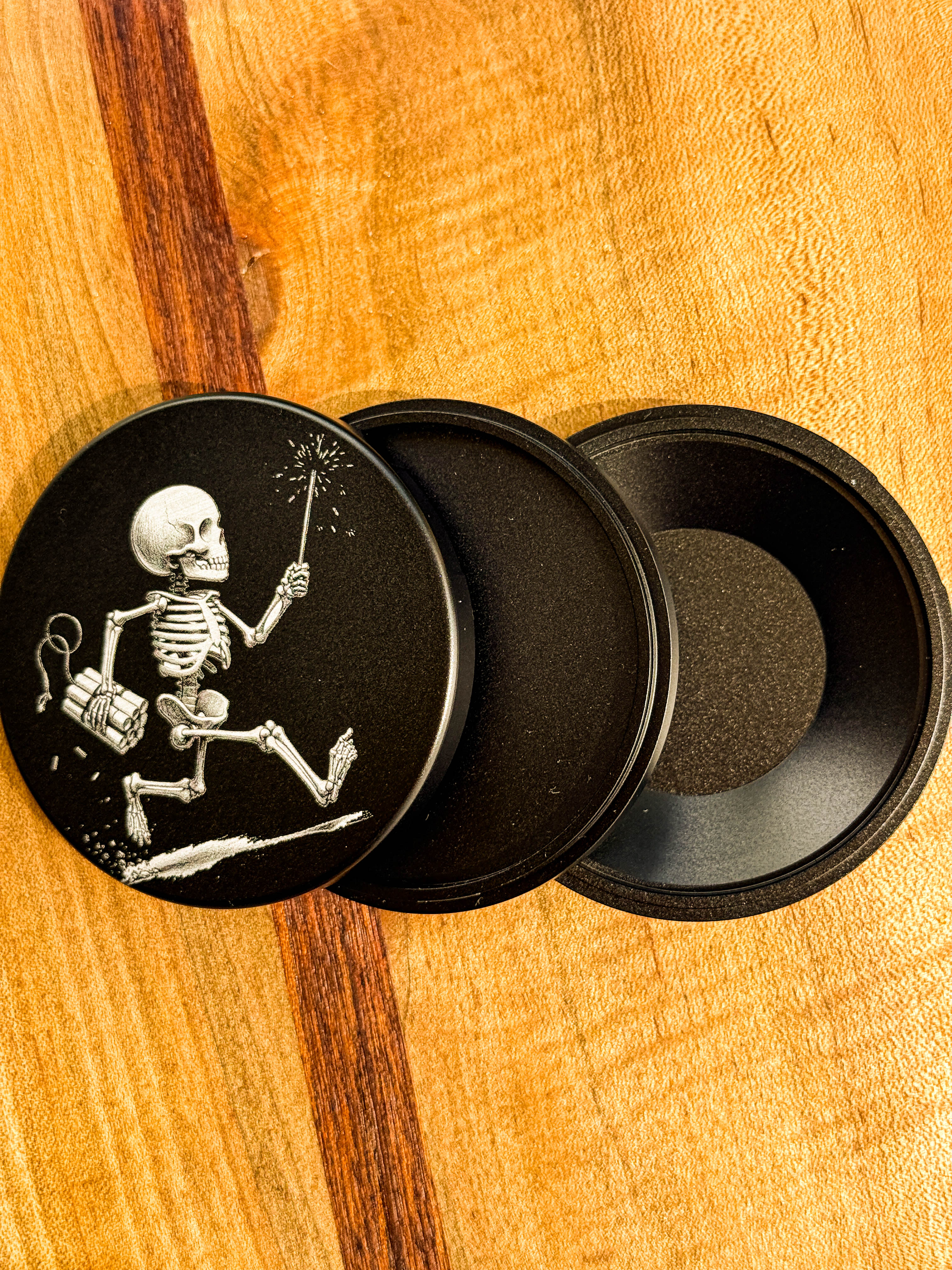 Metal Zyn Can for nicotine pouches with a skeleton carrying a sparkler and dynamite engraved design. With integrated bottle opener. 