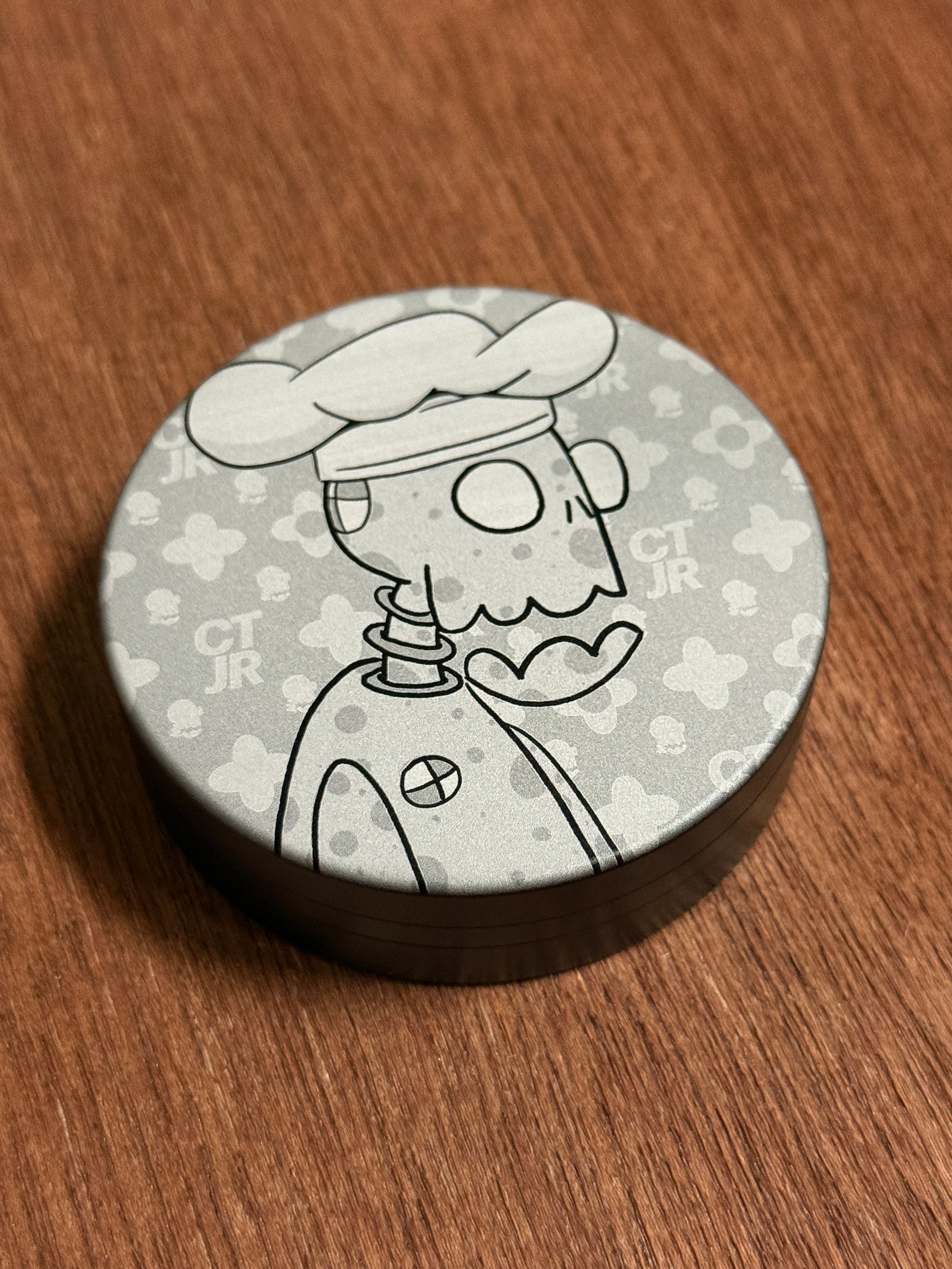 Metal Zyn Can for nicotine pouches with engraved design of chef cartoon Crash Test Joy Ride character. With integrated bottle opener. 