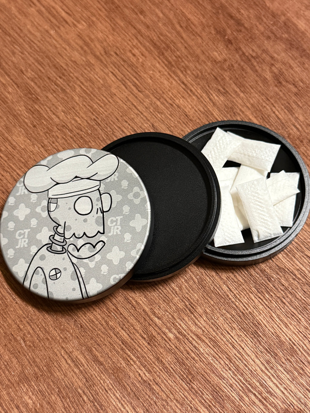 Metal Zyn Can for nicotine pouches with engraved design of desert cartoon Crash Test Joy Ride character. With integrated bottle opener. 