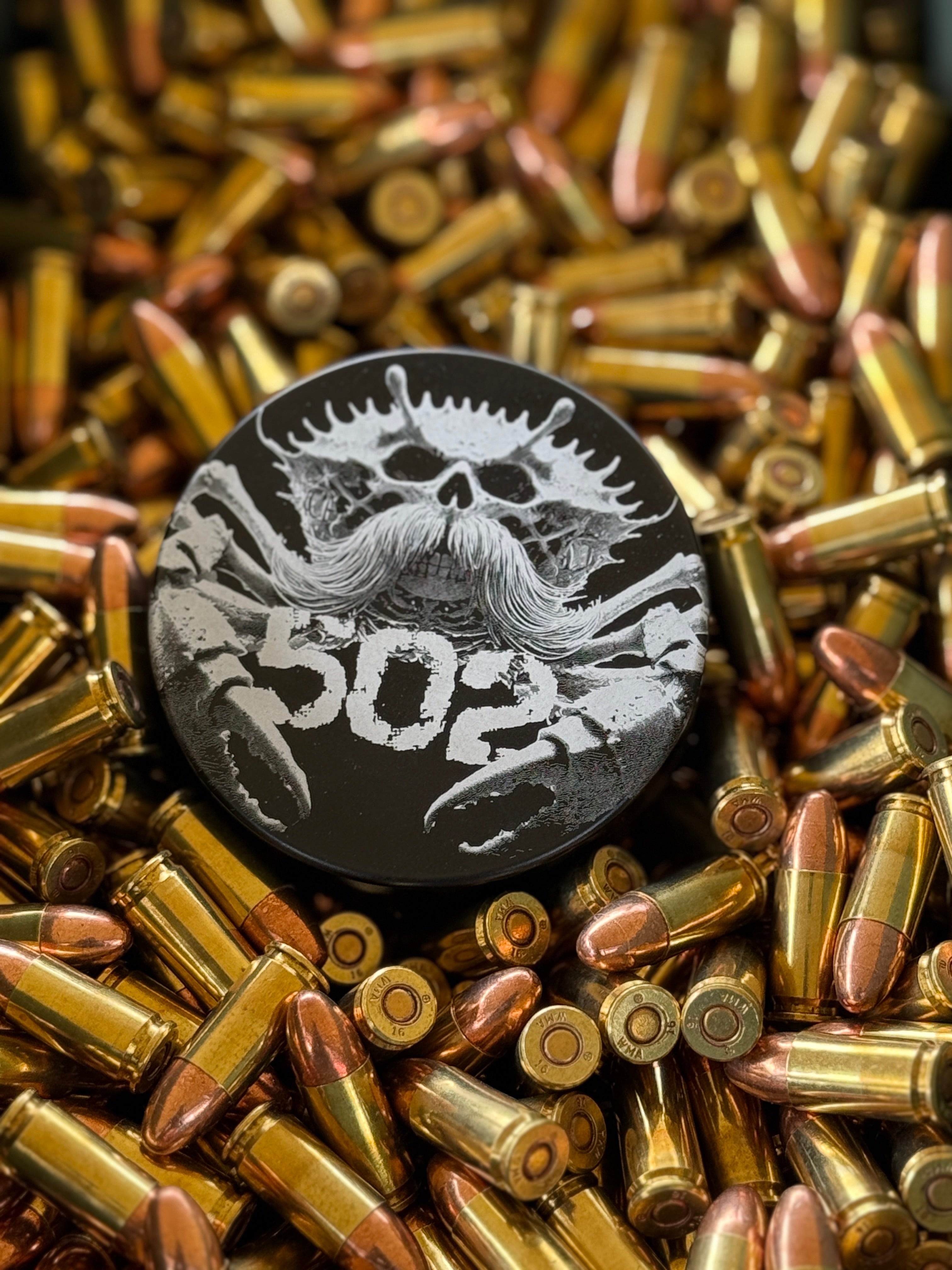 Metal Zyn Can for nicotine pouches with custom engravings. With integrated bottle opener. Displayed on brass.