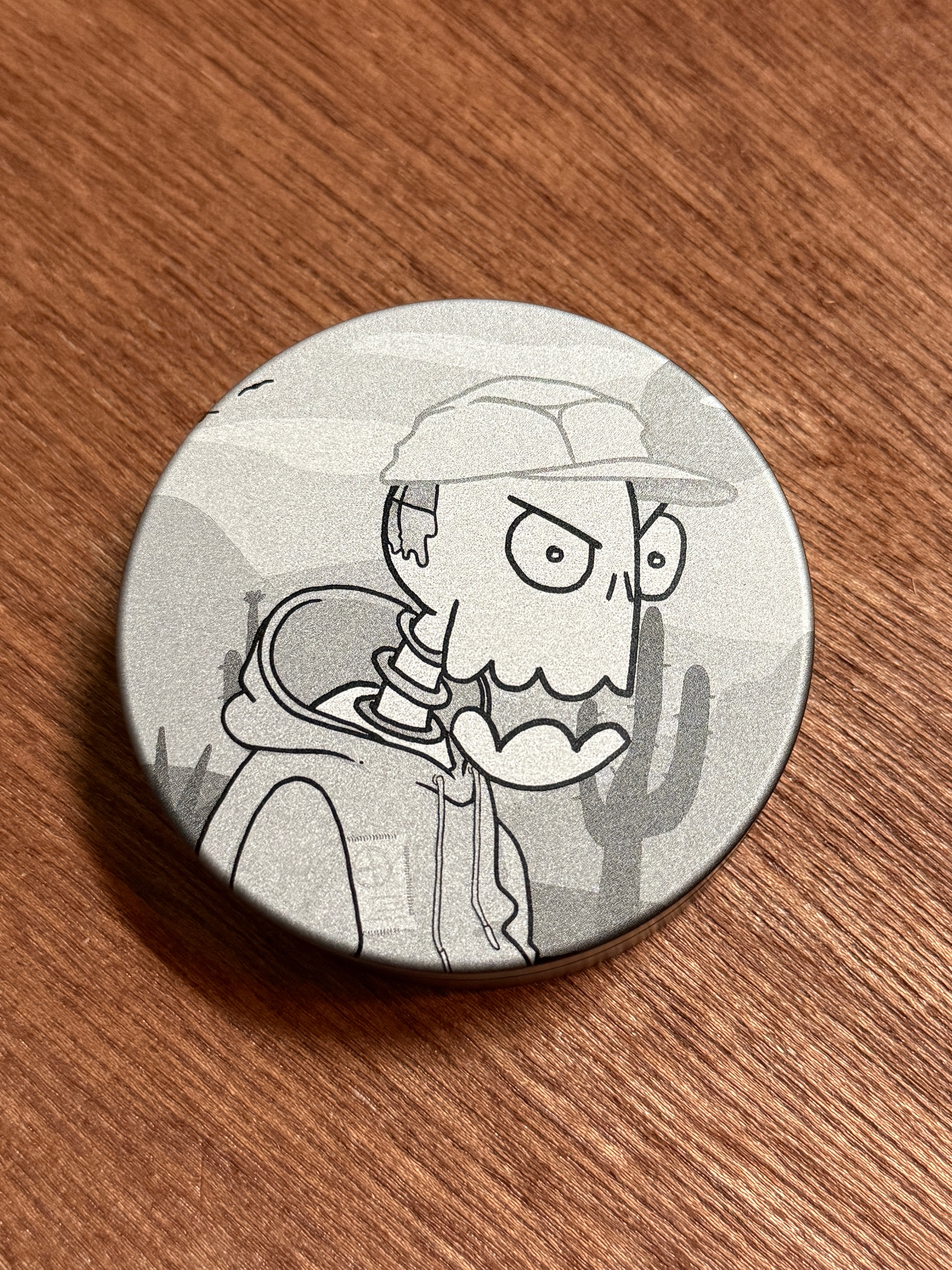 Metal Zyn Can for nicotine pouches with engraved design of desert cartoon Crash Test Joy Ride character. With integrated bottle opener. 