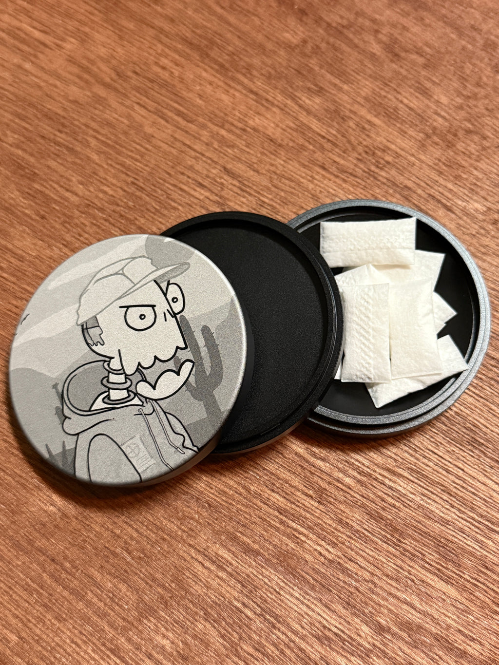 Metal Zyn Can for nicotine pouches with engraved design of desert cartoon Crash Test Joy Ride character. With integrated bottle opener. 