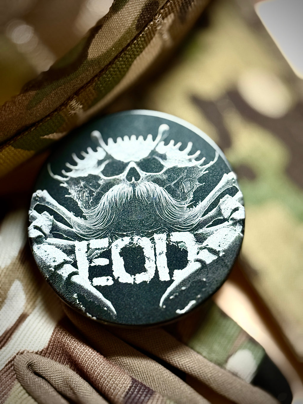 Metal Zyn Can for nicotine pouches with engraved design of an EOD crab with a mustache. With integrated bottle opener. 