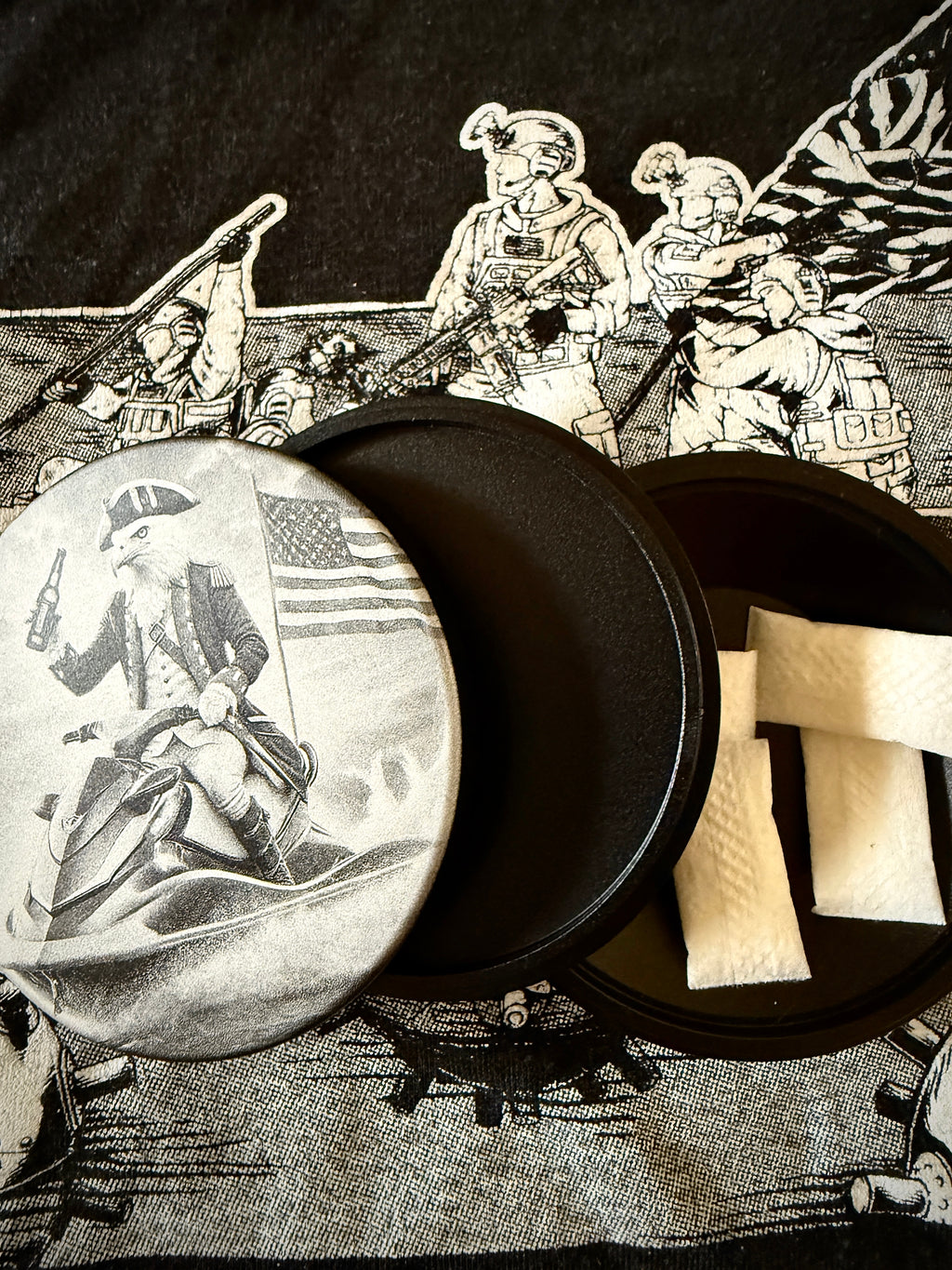 Metal Zyn Can Lid for nicotine pouches with engraved design of a patriotic revolutionary war era eagle riding a jet ski. With integrated bottle opener. 