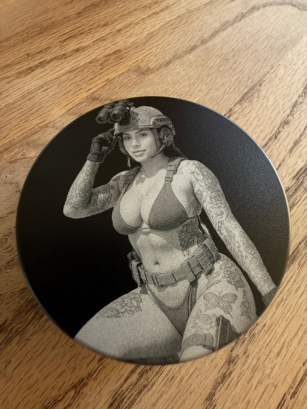 Metal Zyn Can for nicotine pouches with engraved design of "pin-up" style woman in bikini and tactical gear. With integrated bottle opener.